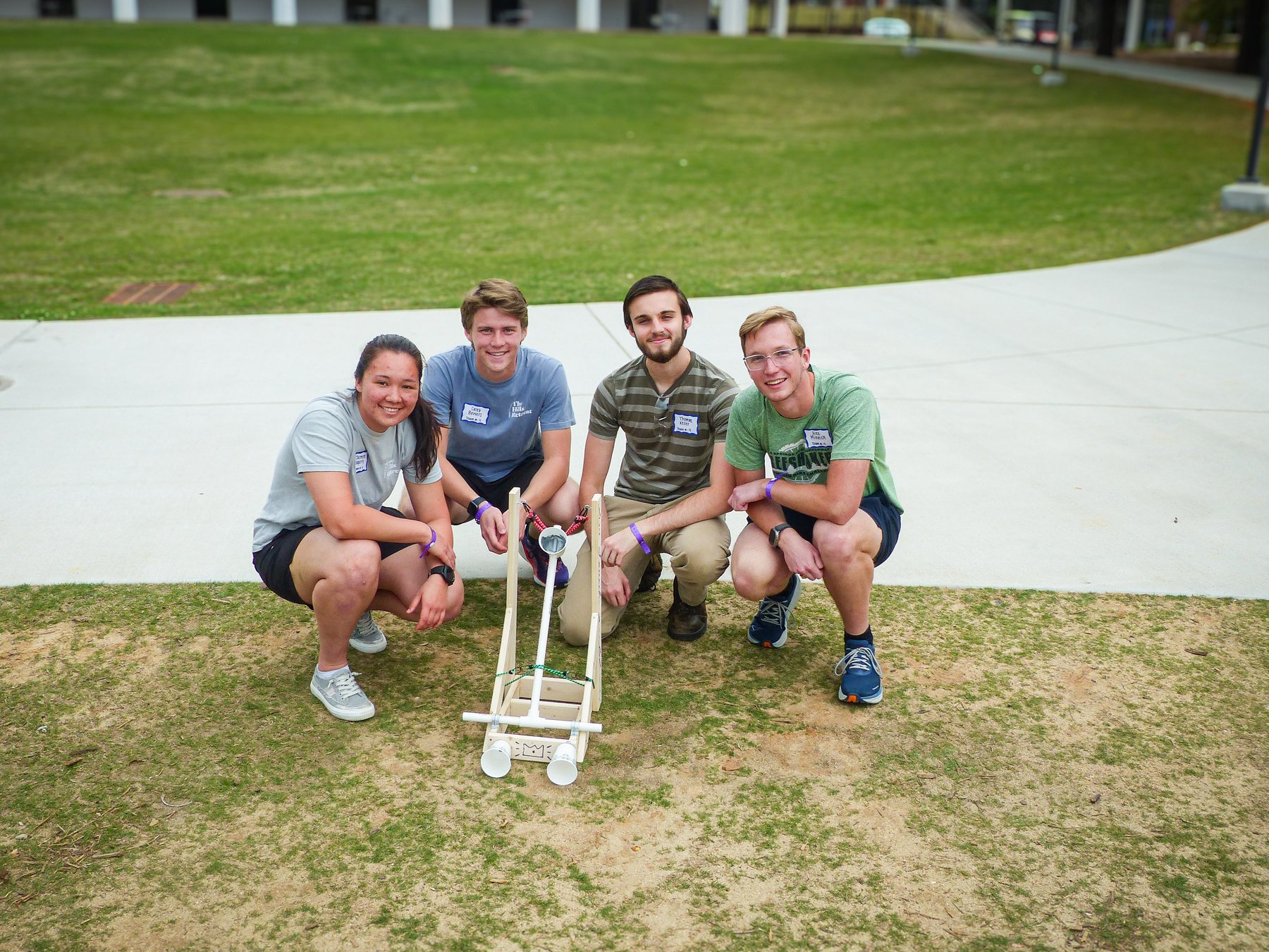 Alex with a four person project team