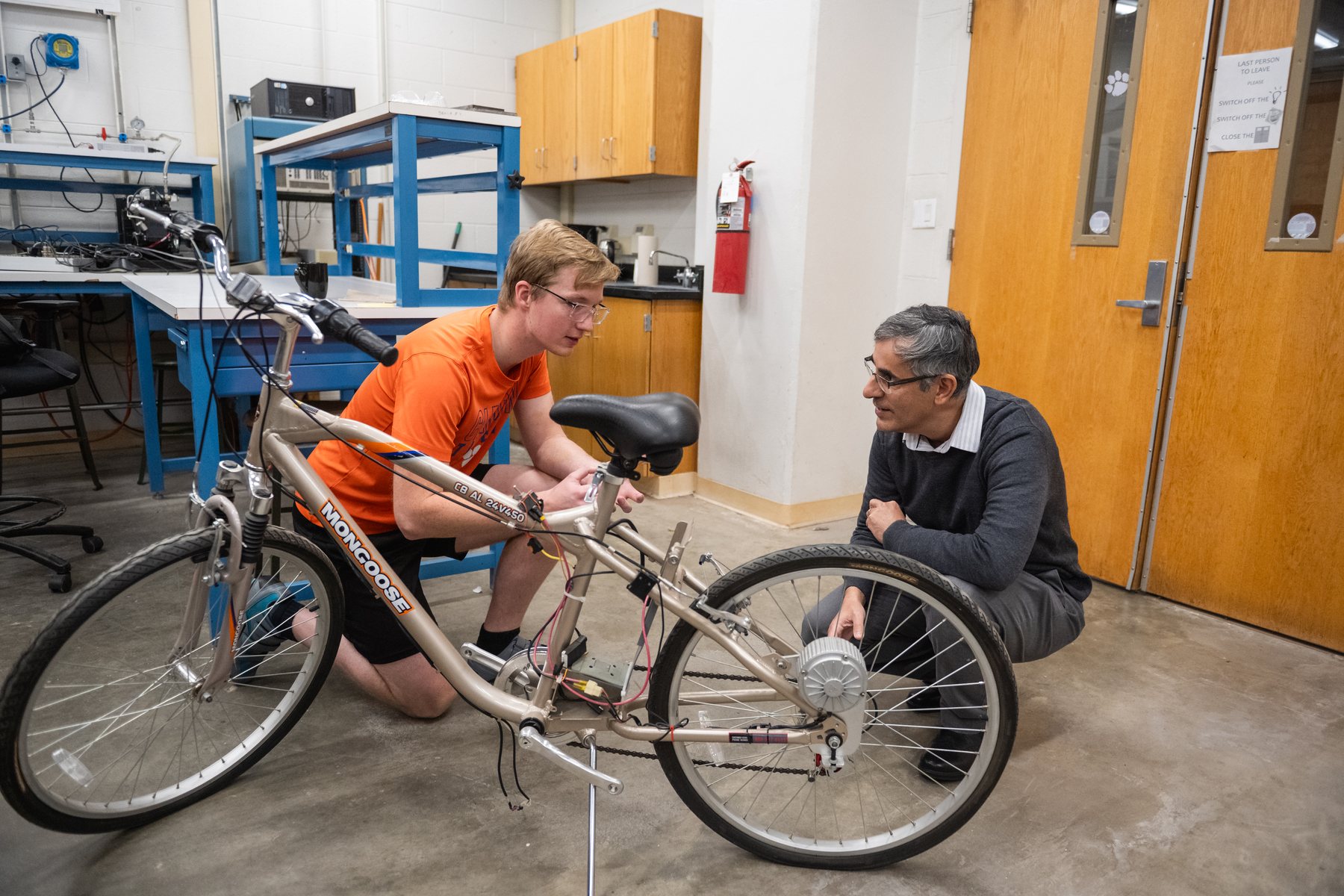 Alex working with cycling research equipment in the lab