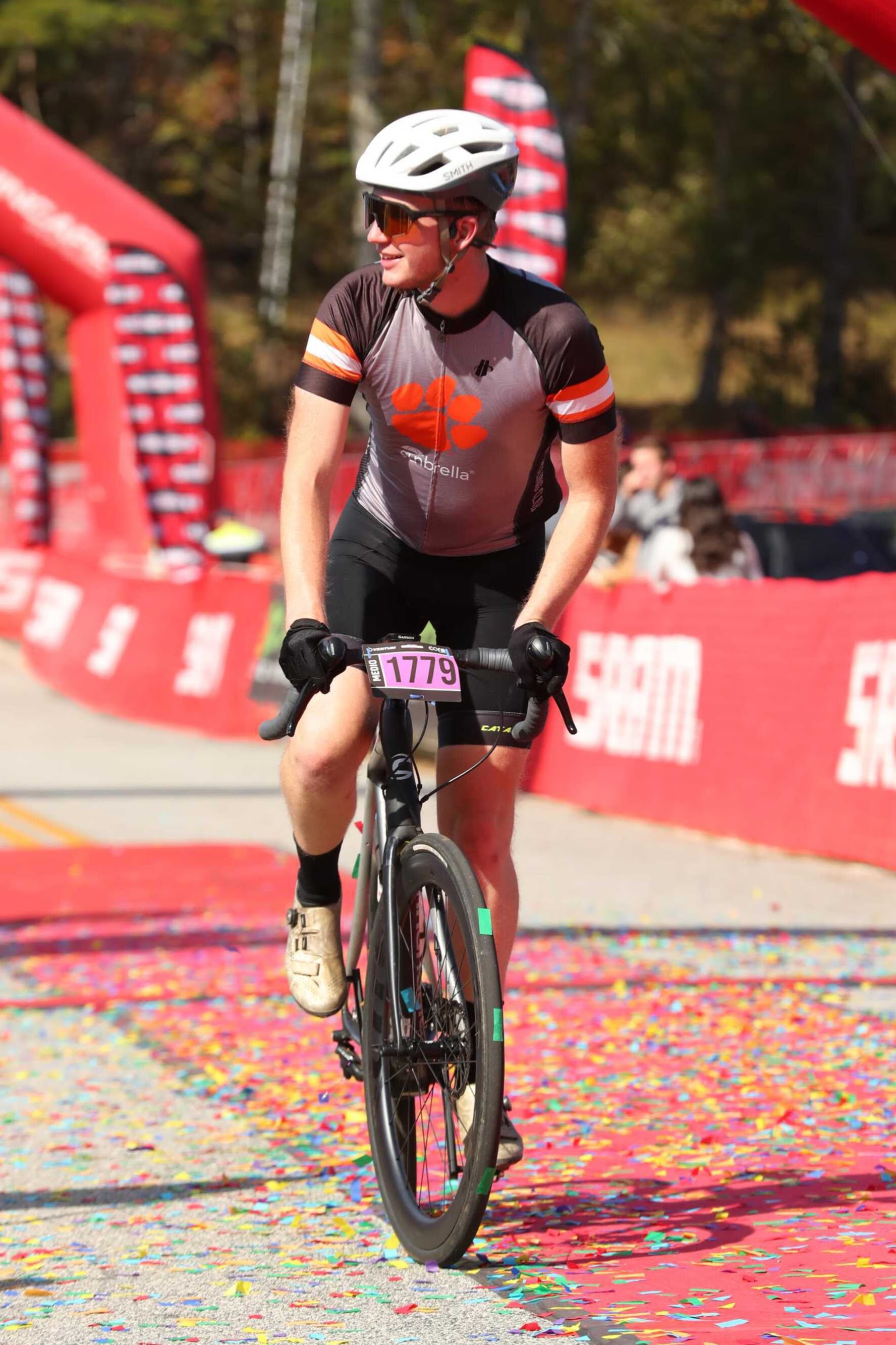 Alex riding a bike through a turn