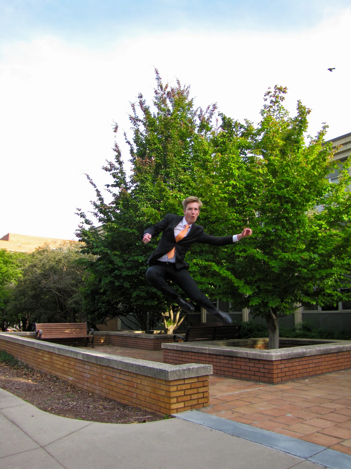 Alex jumping on campus