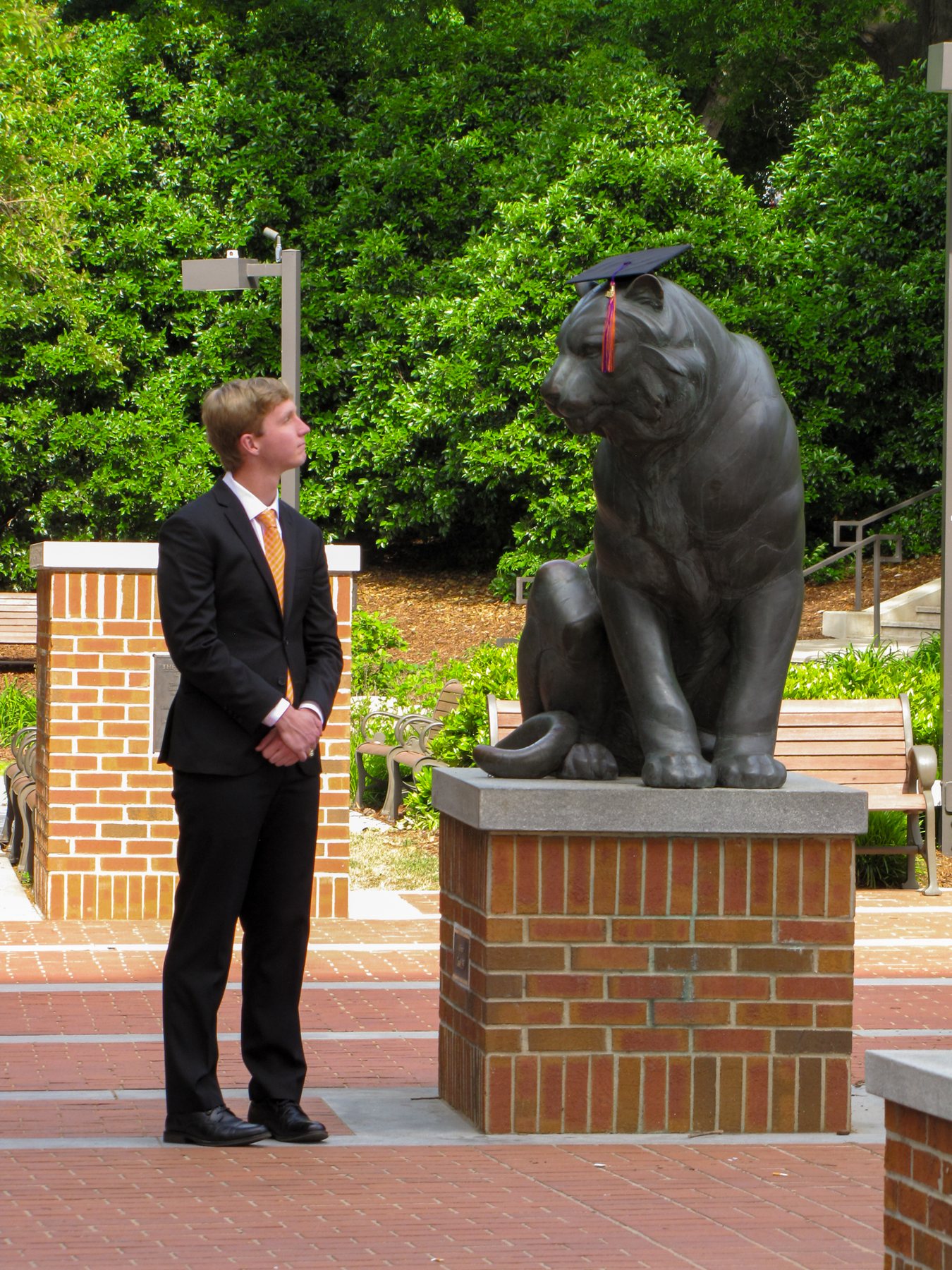 Alex on Clemson campus with tiger statue
