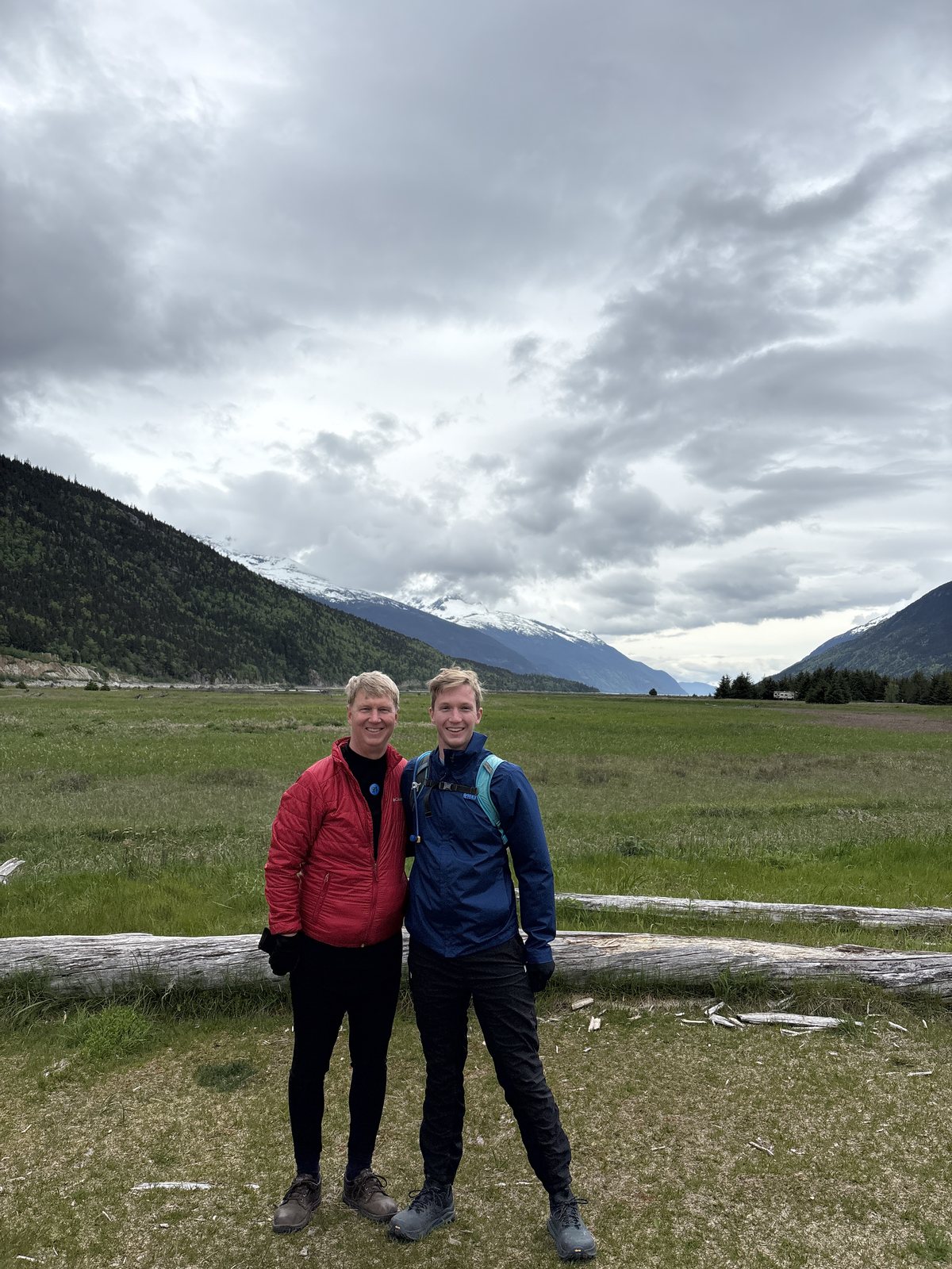 Alex with family in the mountains