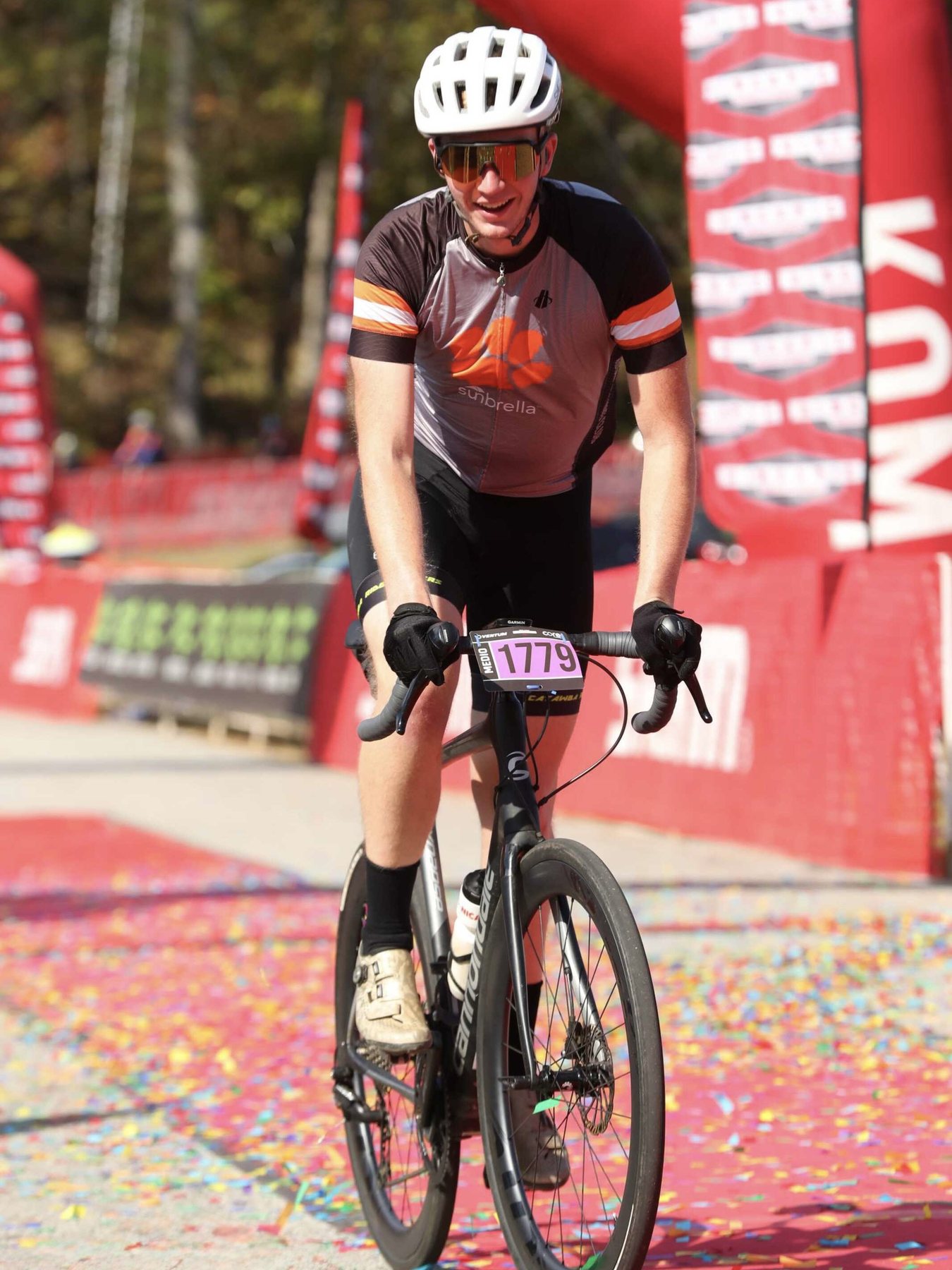 Alex racing on a road bike